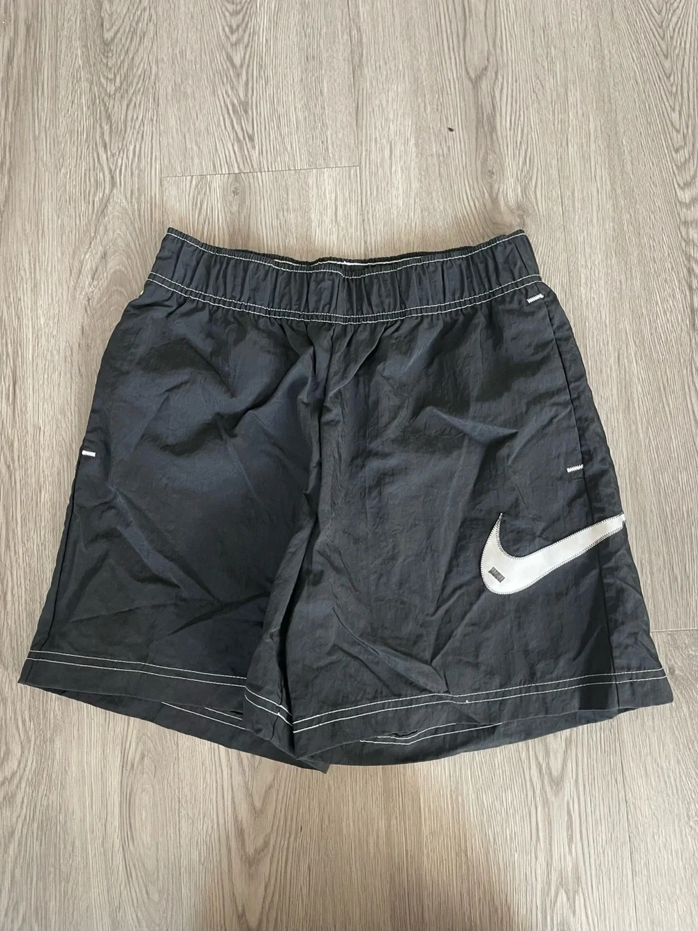 Nike Black Athletic Shorts with White Swoosh Accent